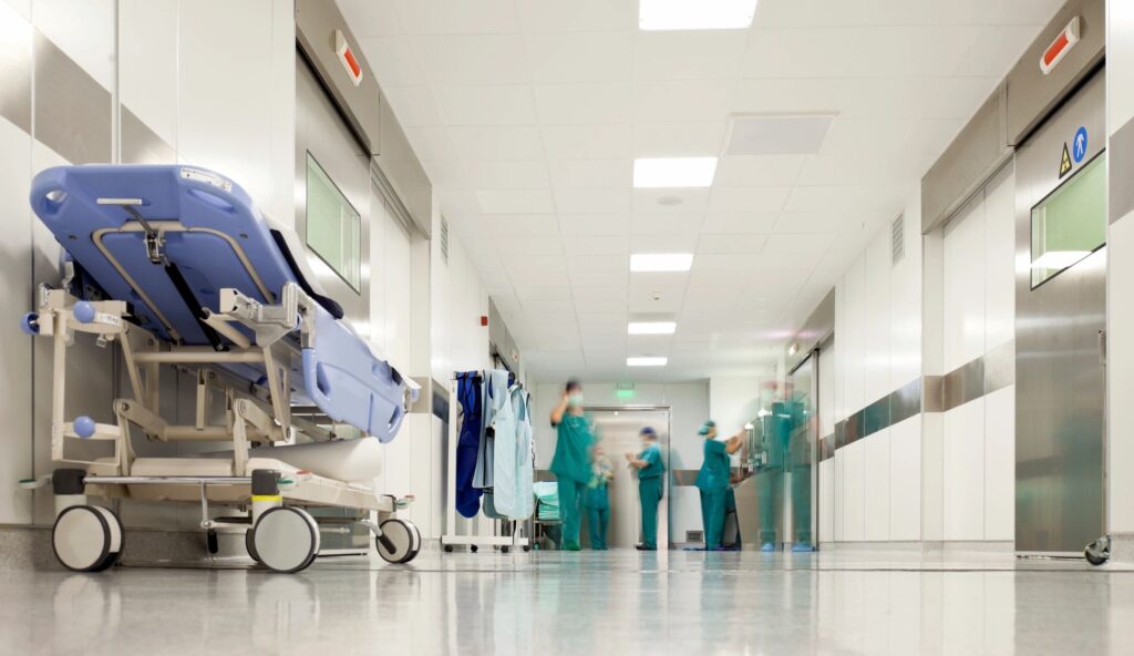 Photo of gurney in a hospital hallway, representing how often slip and fall accident victims end up requiring medical attention, featured by Concord NH slip and fall lawyer David Buckley