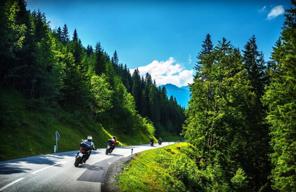 Concord motorcycle accident lawyer photographs motorcyslists rounding the bend on a new hampshire highway. 